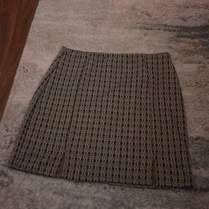 A small boxed, plaid mini skirt.
